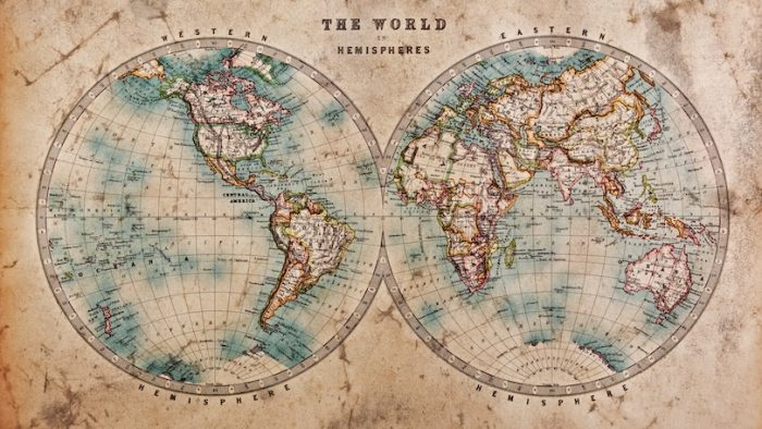 A genuine old stained world map dated from the mid 1800s showing the Western and Eastern Hemispheres with hand coloring.